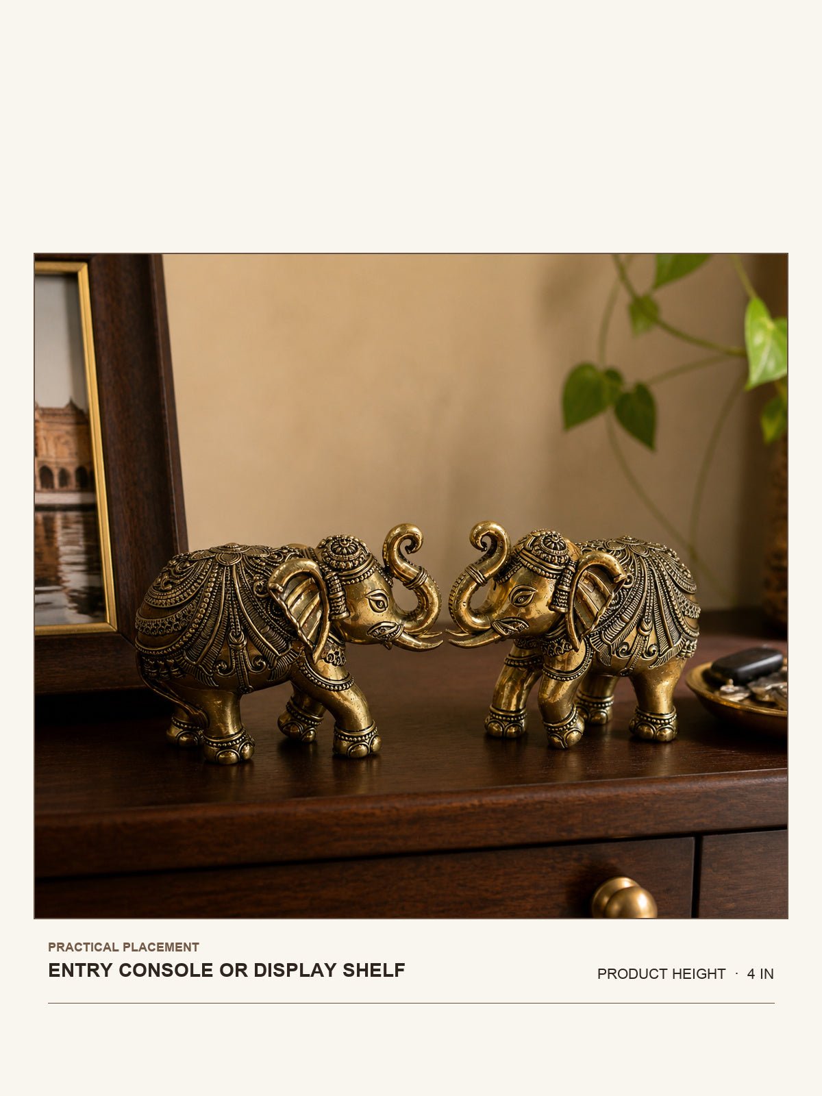 Decorative Brass Elephant Pair shown at its 4-inch height on a entry console or display shelf