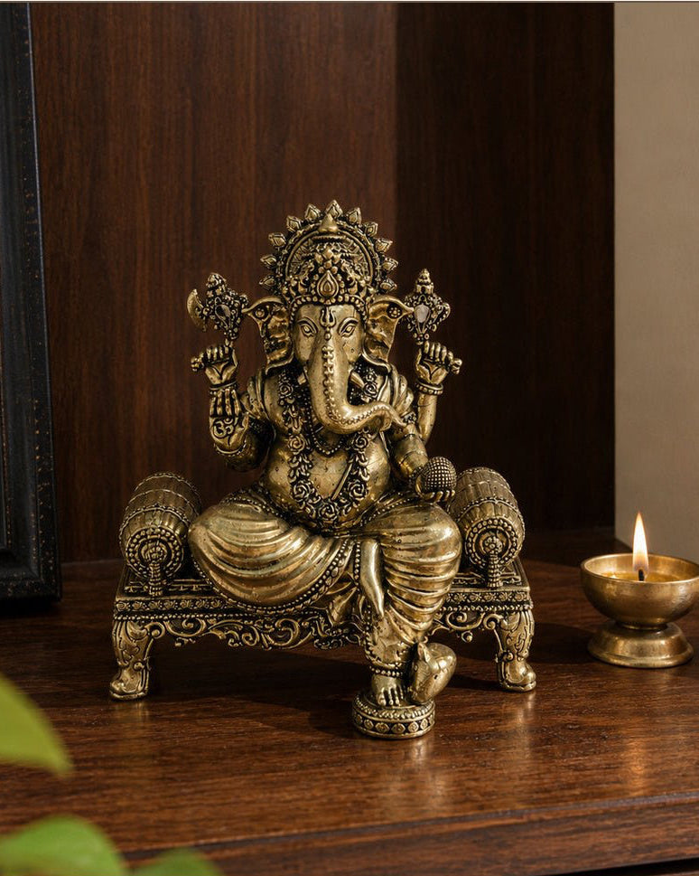 Ganesha Brass Idol on Ornate Throne shown at its 5.5-inch height on a entry console or display shelf