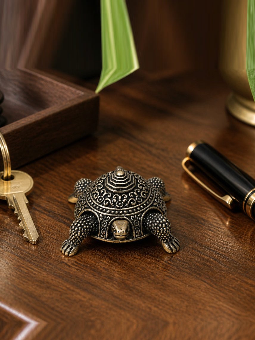 Vastu Tortoise Brass Box shown at its 1.25-inch height on a work desk or entry shelf