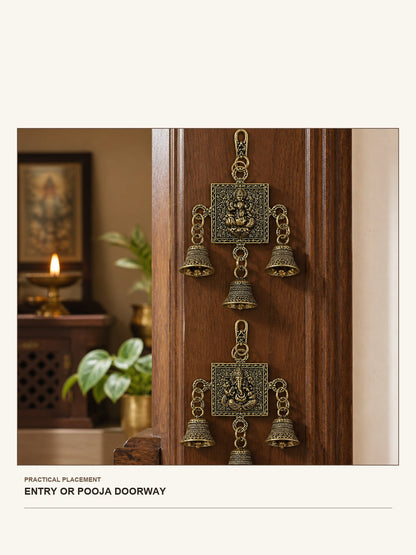 Lakshmi & Ganesha Brass Wall Bell Set shown in a practical entry or pooja doorway setting