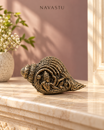 NAVASTU ChatGPT ad creative 2026-10-13 | decorative-brass-conch-with-devotional-motifs