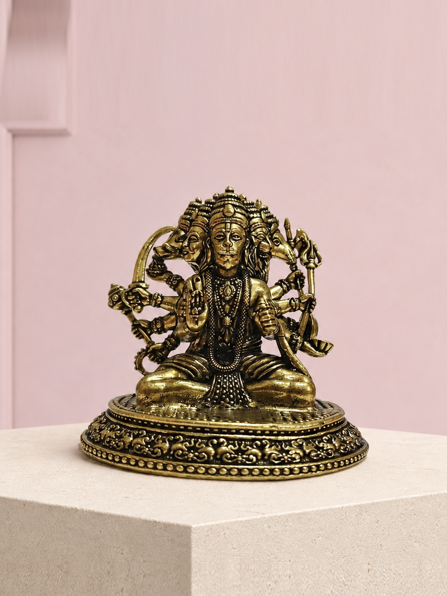 Panchmukhi Hanuman Brass Idol on an ivory platform with a soft mauve heritage backdrop