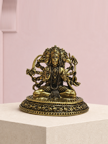 Panchmukhi Hanuman Brass Idol on an ivory platform with a soft mauve heritage backdrop