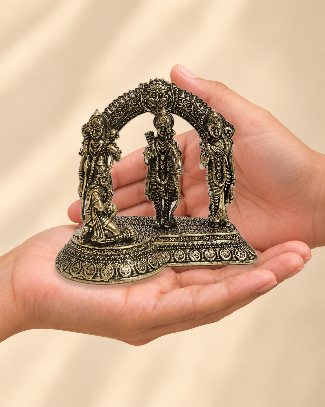 Illustrative scale view of Ram Darbar Brass Idol resting on an adult open palm; listed height 4 inches.