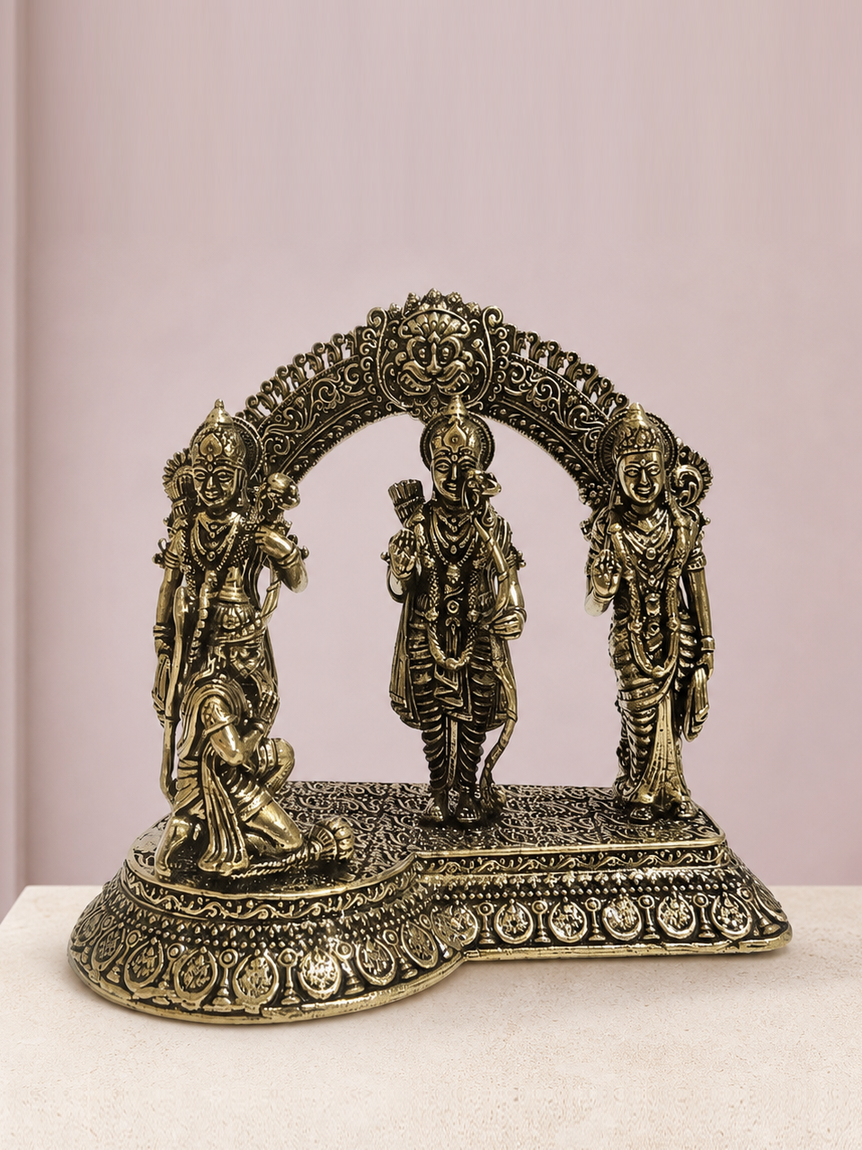 Ram Darbar Brass Idol on an ivory platform with a soft mauve heritage backdrop