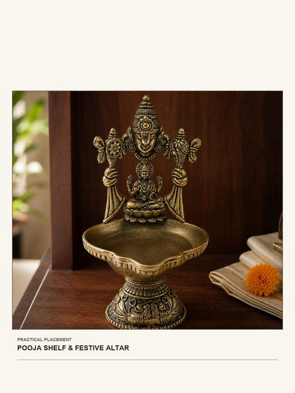 Venkateswara & Lakshmi Brass Diya Stand shown in a practical pooja shelf or festive altar setting
